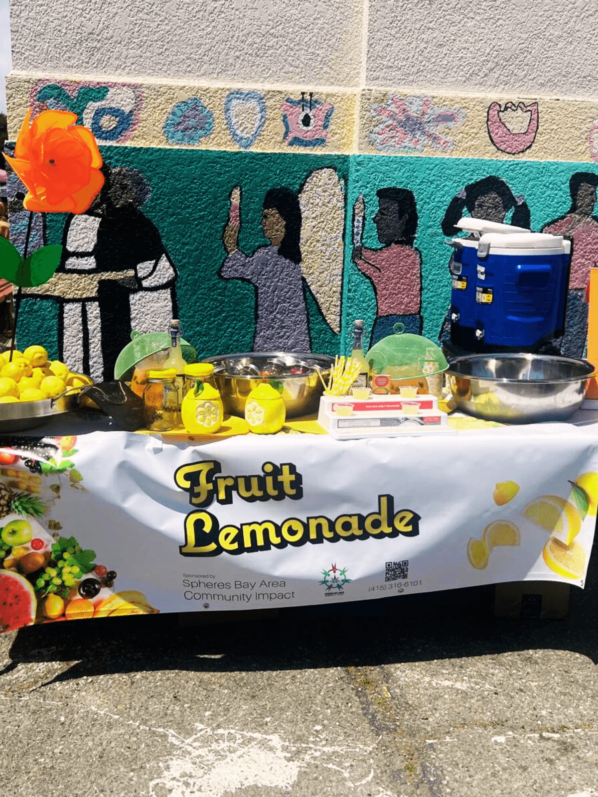 The Fruity Le'mon lemonade stand set up at a community event